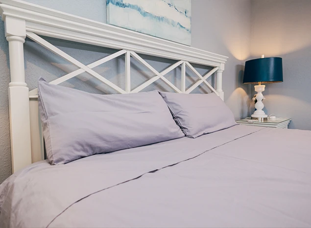 Sleep Connection grounding pillowcase arranged on a bed